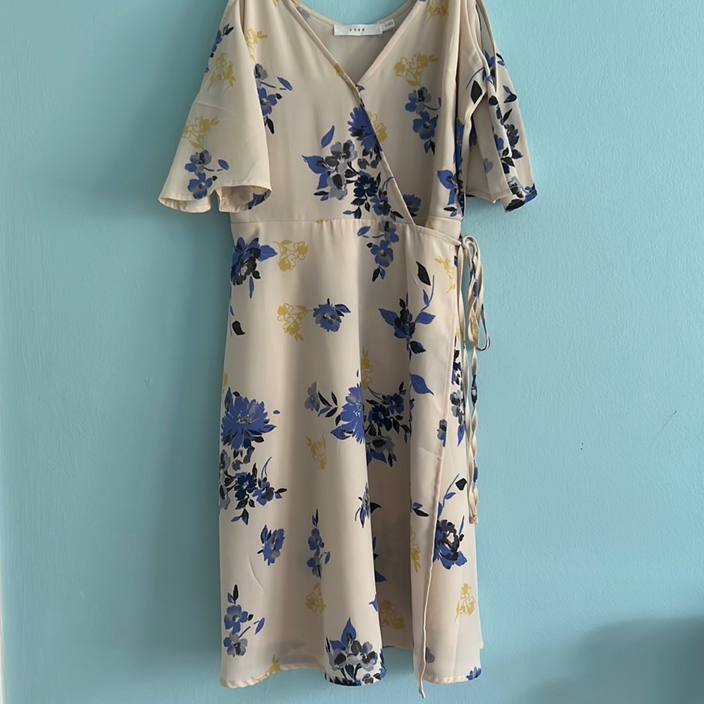 Brand new. Never worn. Pastel Floral Dress. Prefect for the Spring/Summer.